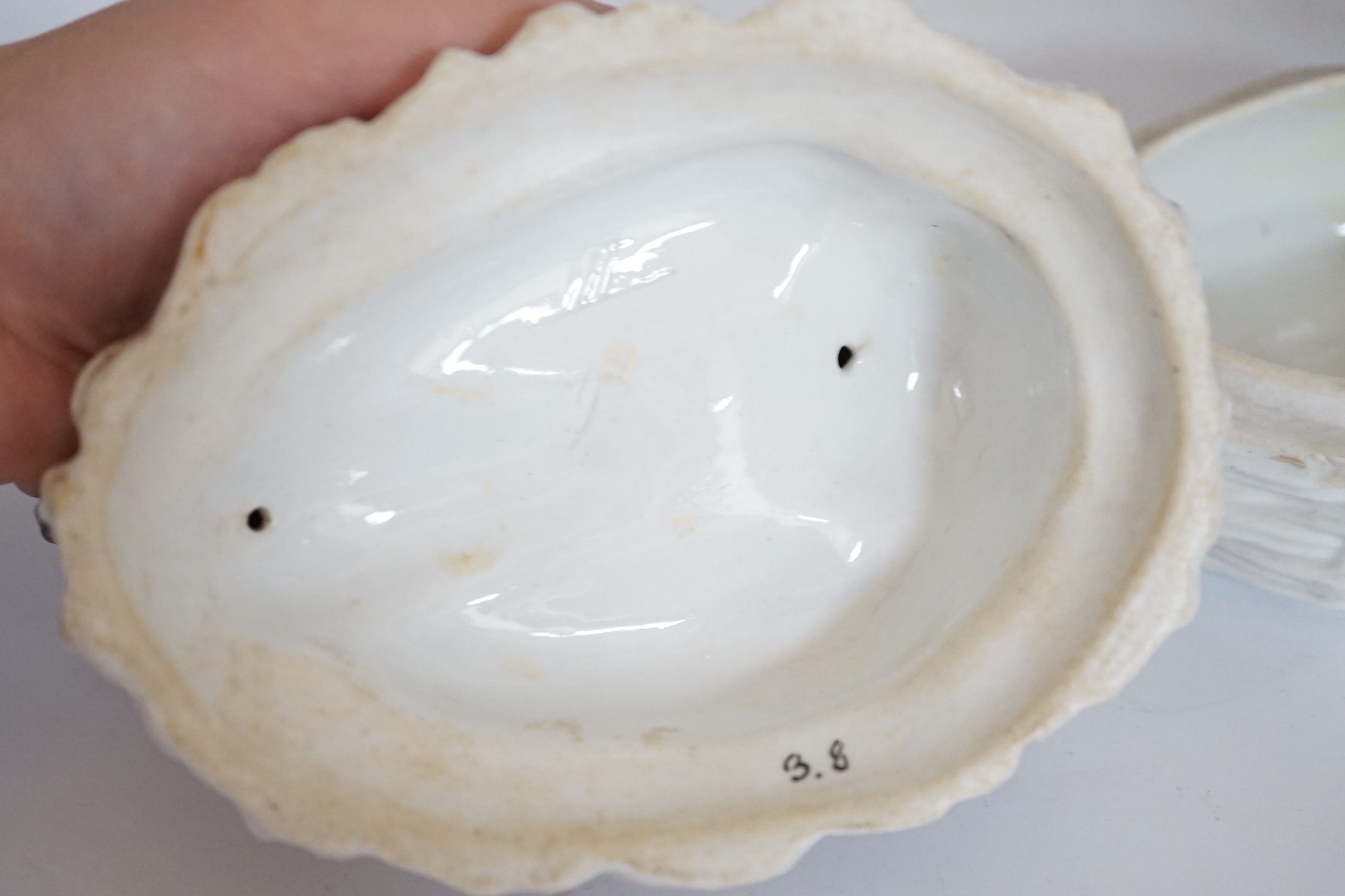 A pair of Dresden porcelain vases and covers (restored) together with a hen egg basket and cover, largest 19cm high (3)